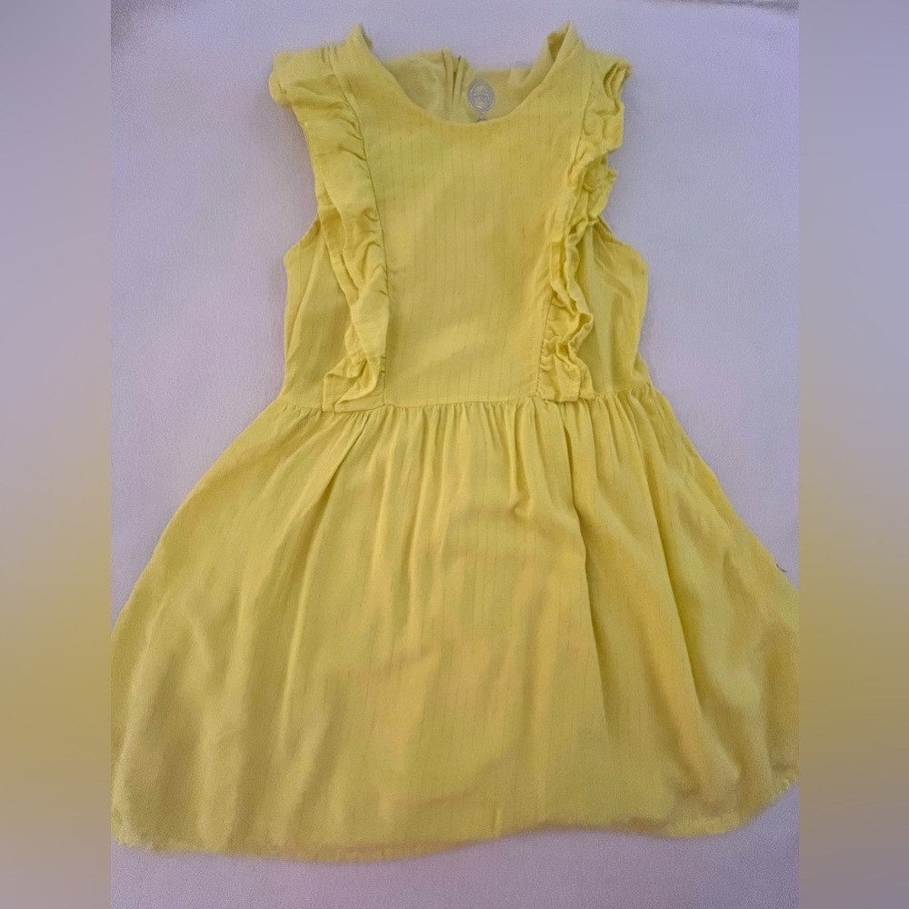 Yellow ruffle dress.